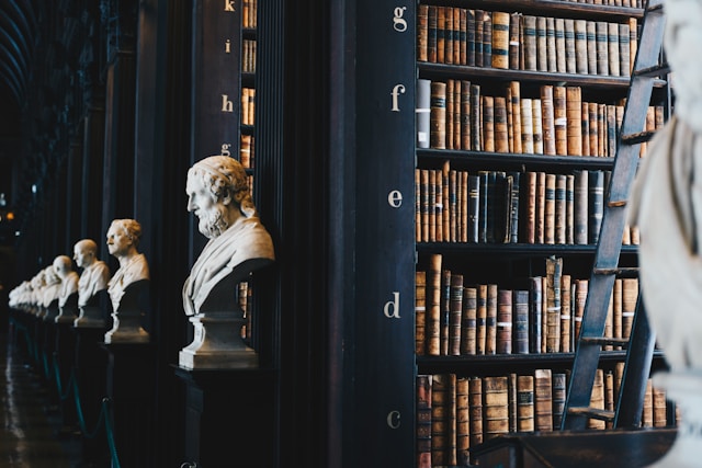 Classical library with scholarly busts